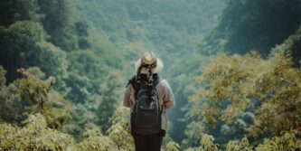 female-standing-hill-looking-jungle_181624-522